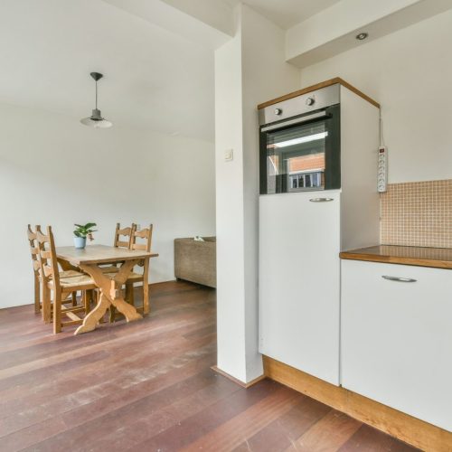 Interior of white wooden kitchen with
