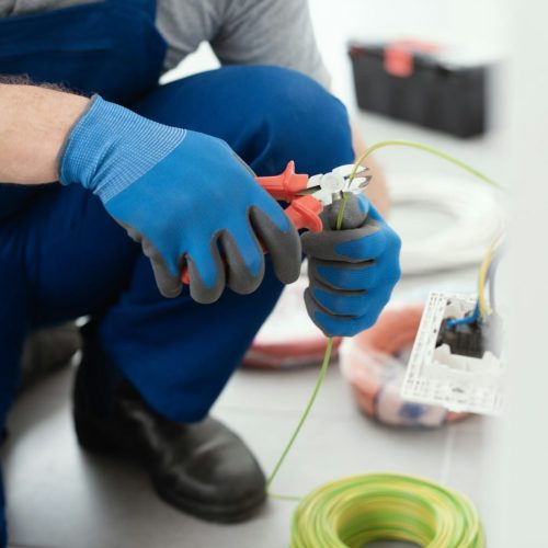 Professional electrician working on the electrical system